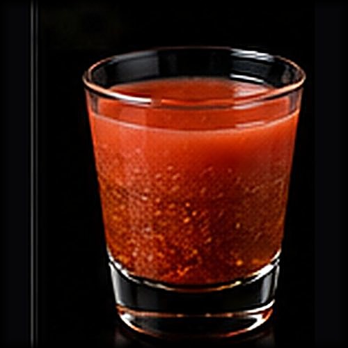 Alabama Slammer classic shot on a dark bar background