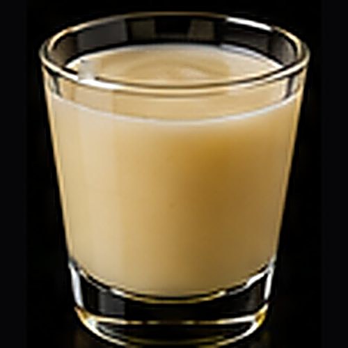 Banana Daiquiri classic cocktail on a dark bar background