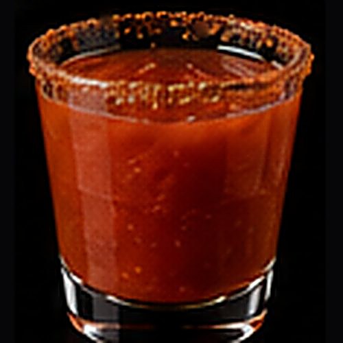 Bloody Maria classic cocktail on a dark bar background