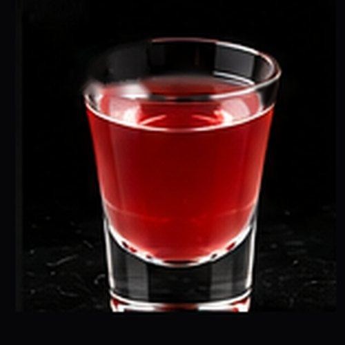 Cosmopolitan classic cocktail on a dark bar background