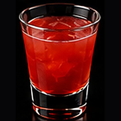 Dirty Shirley classic cocktail on a dark bar background