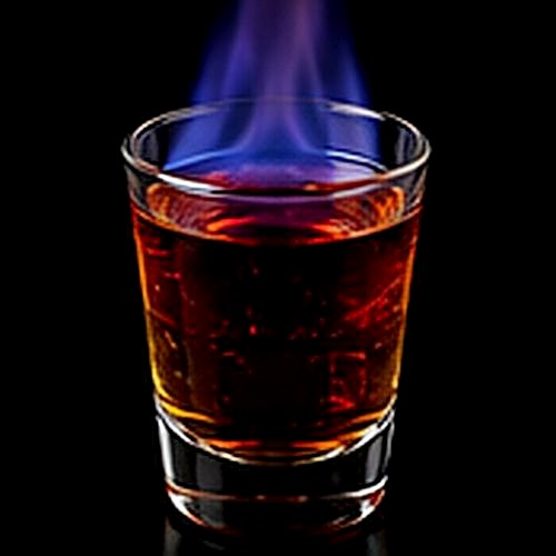 Flaming Dr Pepper classic shot on a dark bar background