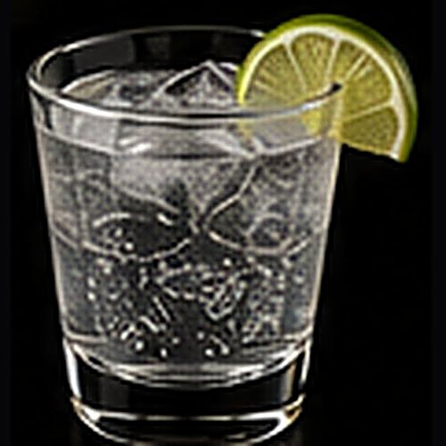 Gin & Tonic classic cocktail on a dark bar background
