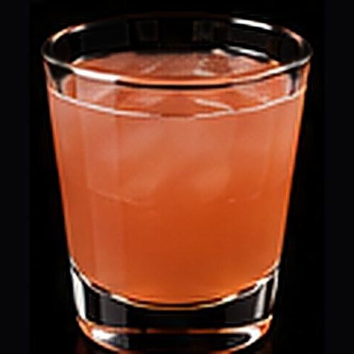 Greyhound classic cocktail on a dark bar background