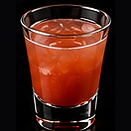Hurricane classic cocktail on a dark bar background