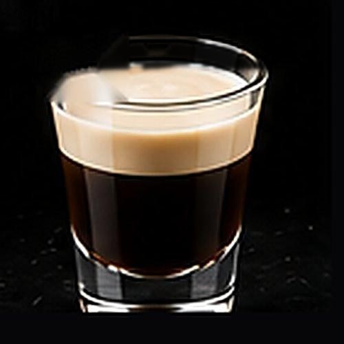 Irish Coffee classic cocktail on a dark bar background