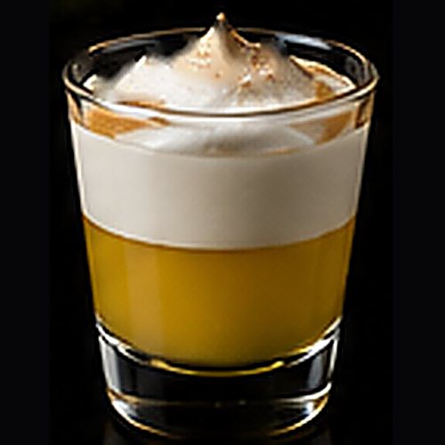 Lemon Meringue classic shot on a dark bar background
