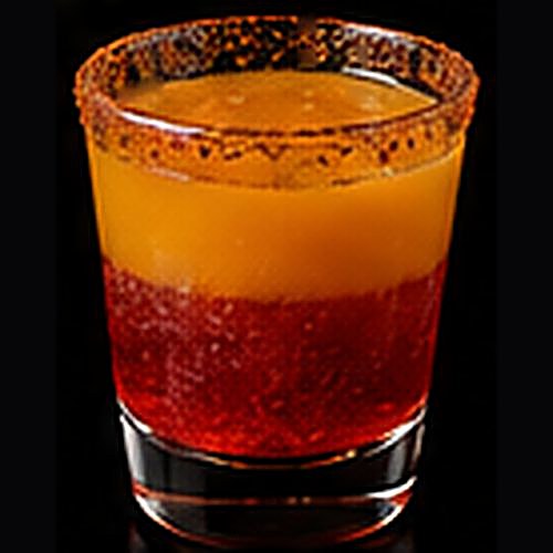Mexican Candy classic shot on a dark bar background