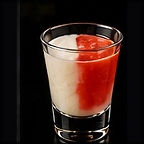 Miami Vice classic cocktail on a dark bar background