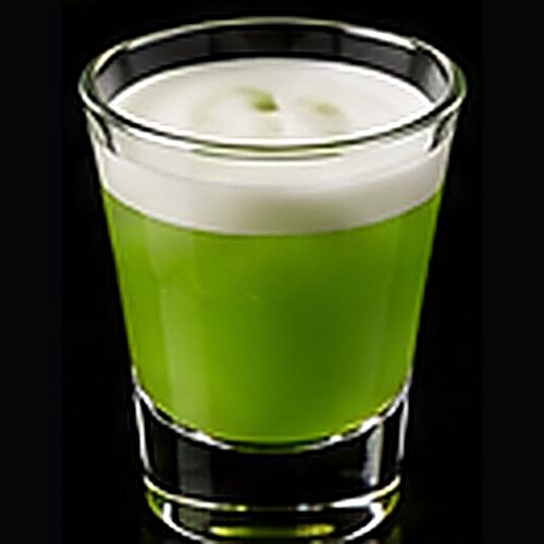 Midori Sour classic cocktail on a dark bar background