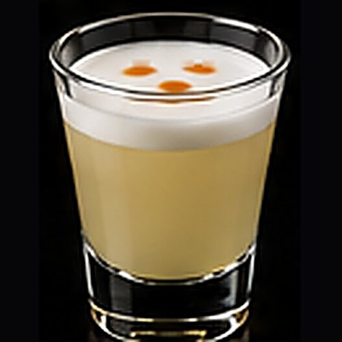 Pisco Sour classic cocktail on a dark bar background