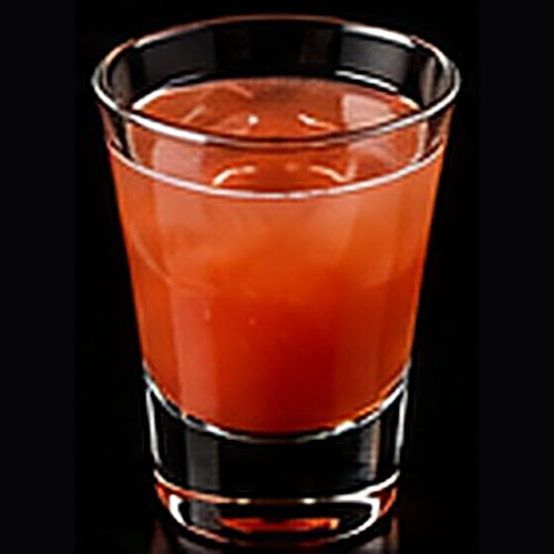 Planter's Punch classic cocktail on a dark bar background