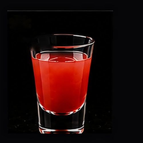 Rum Punch classic shot on a dark bar background