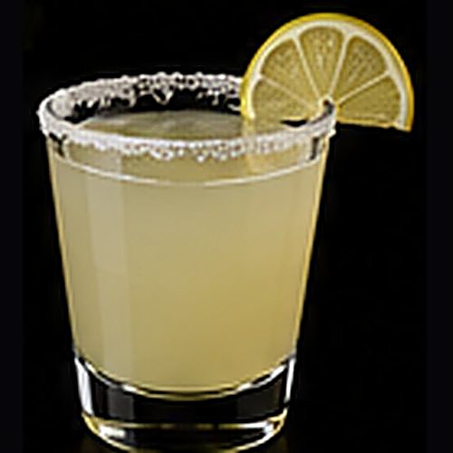 Salty Dog classic cocktail on a dark bar background