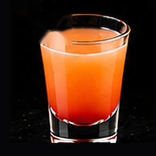 Sex on the Beach classic cocktail on a dark bar background