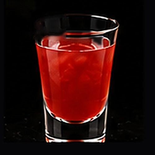 Singapore Sling classic shot on a dark bar background
