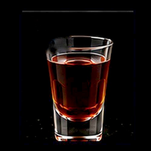 Skittle Bomb classic shot on a dark bar background