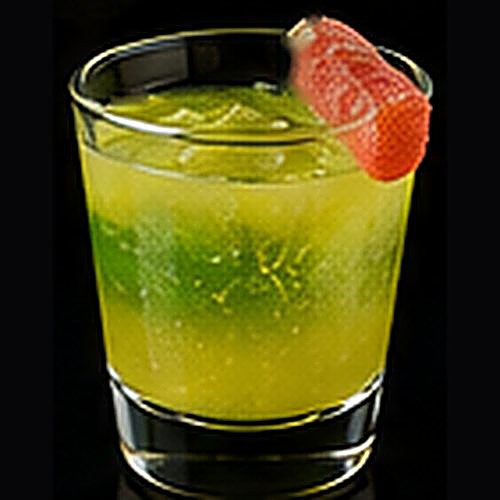 Sour Patch Kid classic shot on a dark bar background