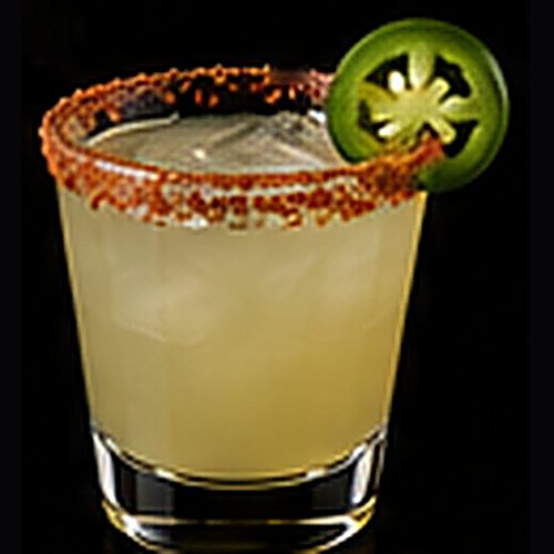 Spicy Margarita classic cocktail on a dark bar background