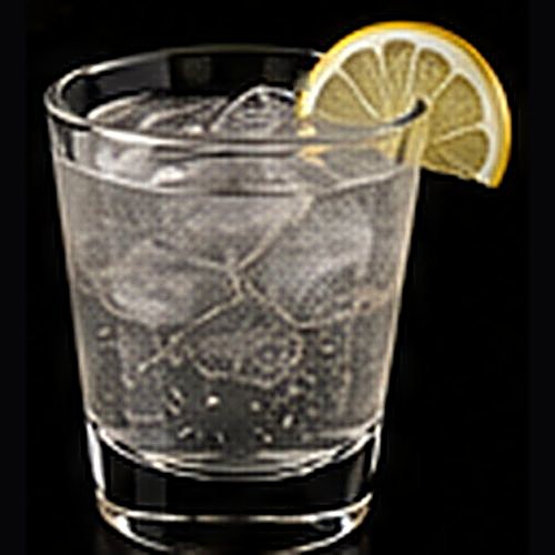 Tom Collins classic cocktail on a dark bar background