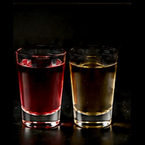 Devil's Reserve Pitchfork Shot Ski served as a seven deadly sins sunday with pitchfork shot-ski presentation on a dark bar background
