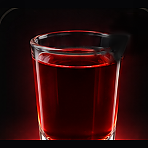 Greed served as a seven deadly sins shot with none listed on a dark bar background