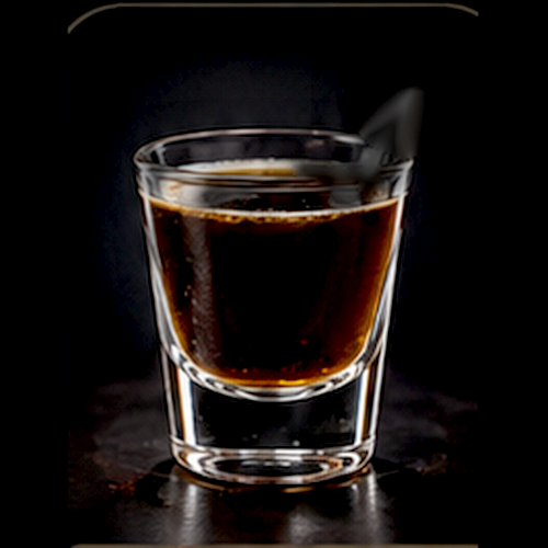 Irish Car Bomb served as a bartender's actual favorite shot with drop-shot presentation on a dark bar background