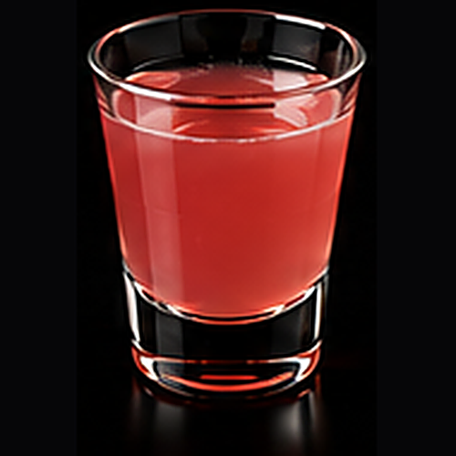 Princess D served in a coupe glass with edible flower on a dark bar background