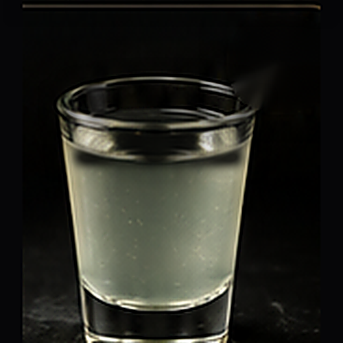 White Claw Seltzer served as a wednesday special with served chilled on a dark bar background